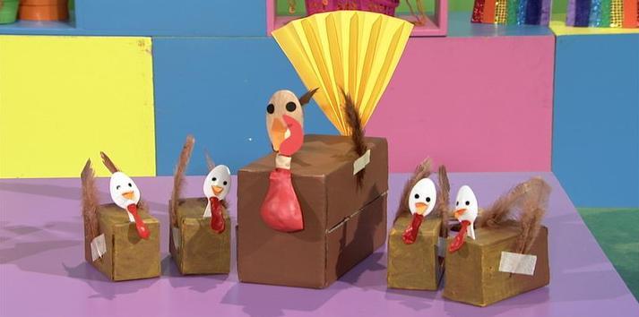 Add two sticker dot eyes. Cut a comb from red cardboard and stick to the top of your hen s head. Tape a deflated red balloon under your hen s beak for a wattle.