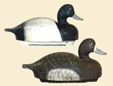 Strong original paint with rub to wood on right side, tail and bill edge. Some flaking on head. Original keel. No stamp. 300-450 34. Pair of bluebills by the Wildfowler Factory.