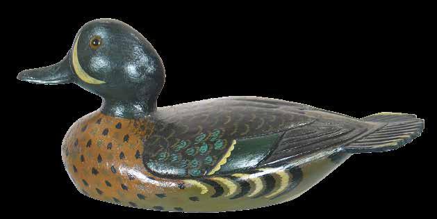 Many believe the pinnacle of his carving career was reached when he created a splendid standing, flapping wing black duck which was displayed in the Iver Johnson sporting
