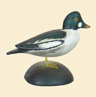 148 149 150, 151 152, 153, 154 155, 156 148. Miniature goldeneye drake by A E Crowell. Split tail with raised wingtips.
