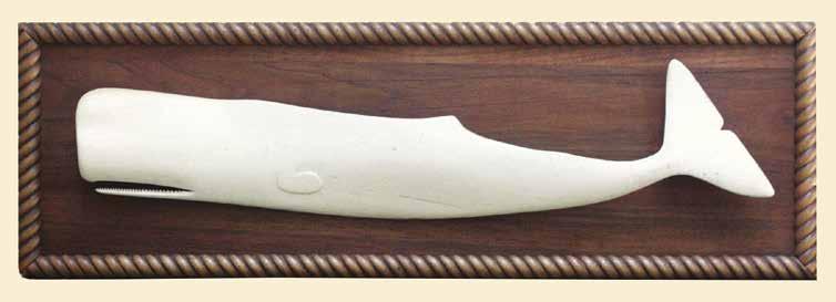 Carved from the pan bone (the flared spoon like rear portion of the sperm whale jaw) with open jaw and side fins.