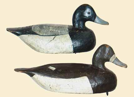 262 263 262. Early bluebill drake by Ira Hudson (1876 1949) of Chincoteague, VA. His stylish and desirable football shape. Original paint with light to moderate overall gunning wear.