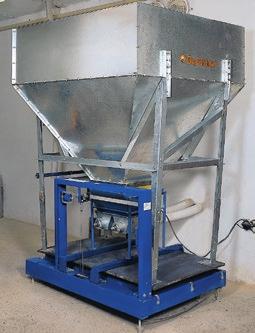 FEED WEIGHING Controlled feeding is a significant factor in broiler breeder management.
