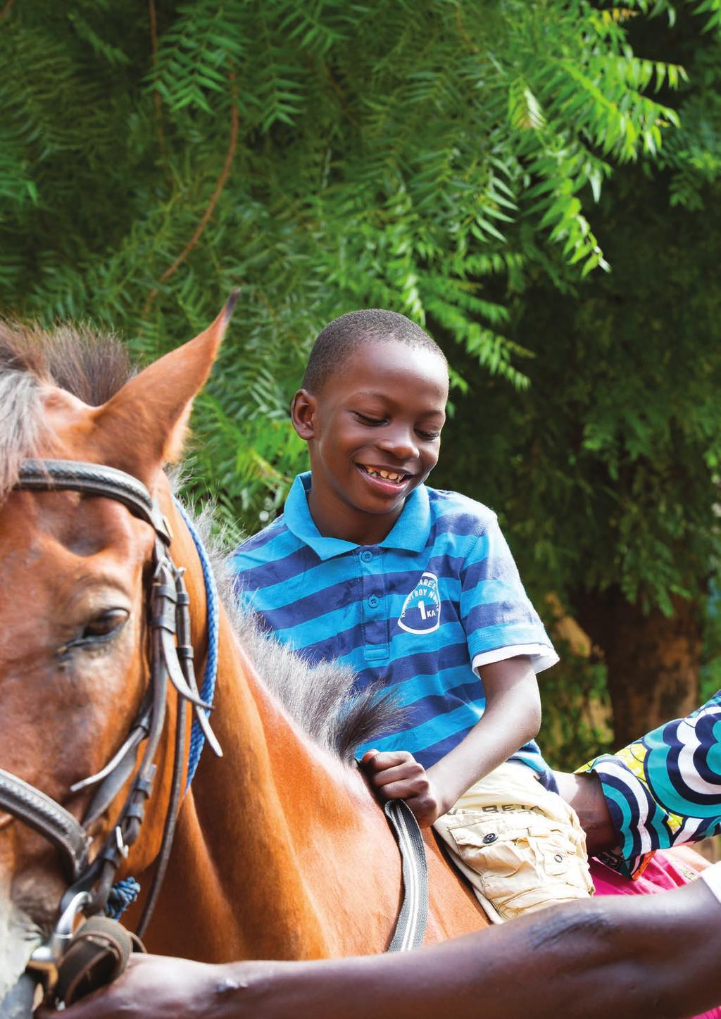 A young owner proudly presents his mule Anne Heslop Mali s riding school for disabled children Changing lives, one ride at a time.