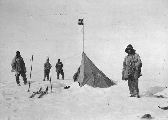 Figure 3: Scott and his men at the South Pole beside tent & flag the Norwegians had left to mark the spot (source: photo Lawrence Oates) While Amundsen returned triumphantly to his base camp, pulled
