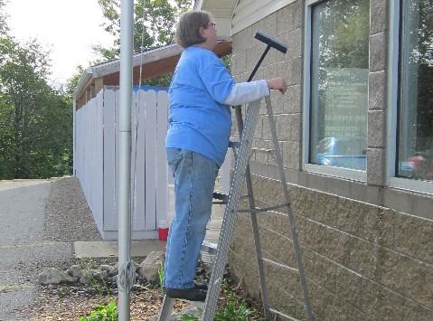 Caring volunteers power-washed the outside of the shelter, as well as all the