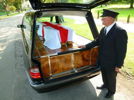 The coffin is carried to the grave and once everyone is gathered round the coffin is lowered into the ground.