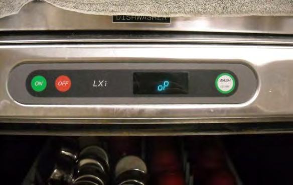 8. Close the door to the sanitizer, and press the button that says Wash. If you re putting in the first load of the day, you ll need to press on, then wash.