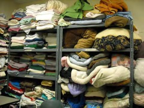 Fold all towels and bedding as neatly as possible and stack with like items on the shelves.