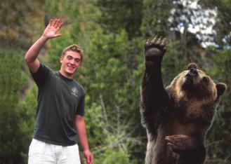 3A Russell Chadwick copies Tank as he holds his paw up in the air. Russell Chadwick wrestles with a little bear cub. 1 5 10 Russell Chadwick remembers the summer he turned 16.