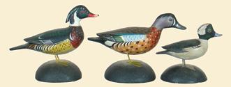 62, 63, 64 65(PR), 66, 67(PR) 68(3) 62. Miniature wood duck drake by Crowell. Split tail with raised wingtips and finely carved crest.