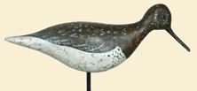 Wings are effectively defined with a carved chine which is unusual for a shorebird. Painted wingtips and dabbed feather detail.