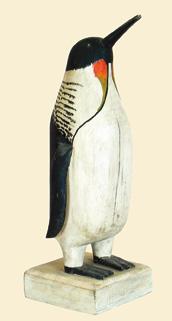 Large carved penguin with wooden feet and applied wings made in the manner of Charles Hart. Stands approximately 29 ¼ from bottom of stand to tip of bill.