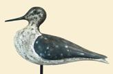 Carved shorebird with tucked head and carved raised wingtips. Condition, antiqued surface. 50-100 359. Lot of two shorebird carvings.