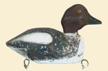 Huge merganser hen from Nova Scotia measuring 23 inches from breast to tip of large paddle tail. Applied bottom board with carved crest and bill carving meant to imitate the serrations of the species.