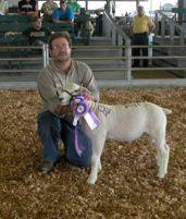 Kerry Richardson, shown at the 2011 National Show and Sale holding his Reserve Grand Champion ram lamb.