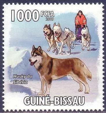 Right: A slogan cancel showing a musher with his team, postmarked in Nome, Alaska. Below: A cover commemorating the 75 th anniversary of Rotary International.