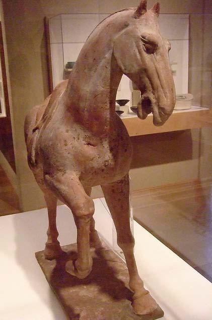 With its Slted head, raised foot, and wide- open eyes and nostrils, this Standing Horse