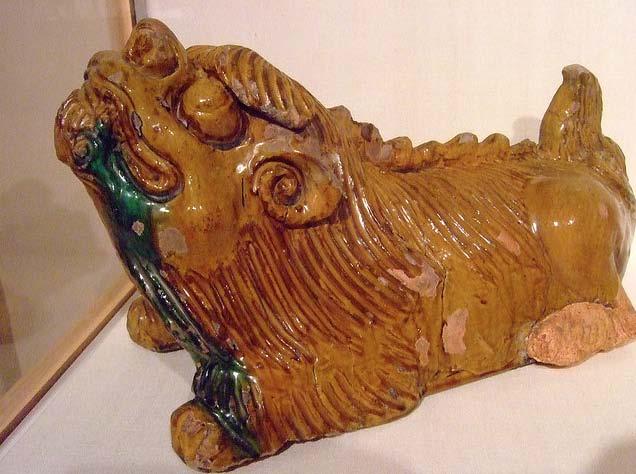 Hundreds of years ago, a Chinese homeowner had this roof Sle of a lion- dog created to protect his home.