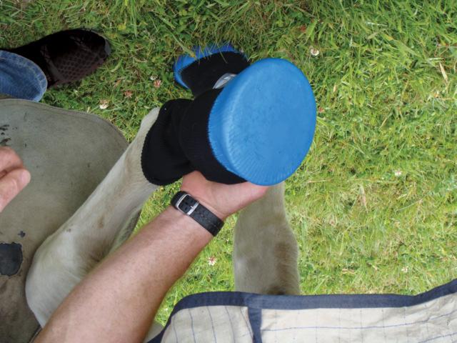 Rubber dipped sock which breathes while still protecting and soaking the damaged hoof.