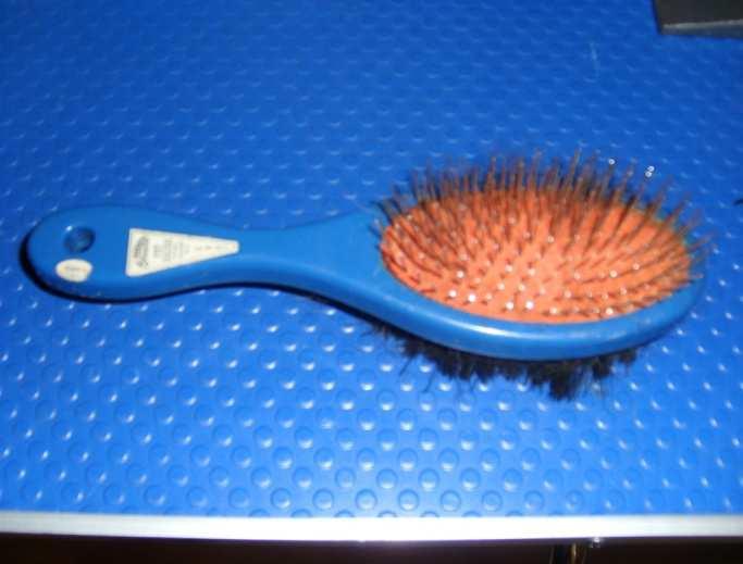 A heavy slicker brush is ideal for dense, wiry, curly or wavy coats. It is also useful for removing the dead coat on double-coated breeds such as Arctic breeds and shepherds.