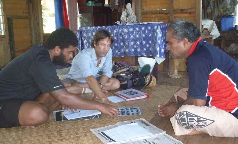 Figure 2. Soni (left) and Steve (center) conducting a questionnaire-based interview of a fisher (image: Steven Purcell). Fisher perceptions Purcell et al.