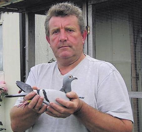 Gary Spavin 'stripped' and waiting for his birds with his pet cat. They build 'em tough up in Lancaster!