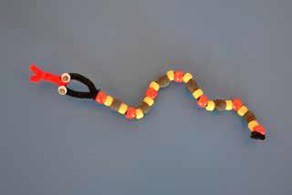 Beaded Coral Snake Materials: Googly eyes Glue Red, yellow, and black pony beads Chenille craft stems (Black 1 for each Cub Scout; Red 1 for every 4 Cub Scouts) Scissors Tags with the rhyme Red and