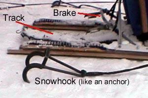 When the bar is stepped on, the claws dig into the snow to slow and stop the team. In addition to these common features, most sleds also have a few important additional components.