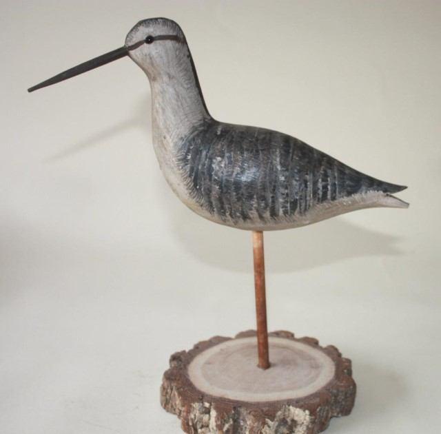 Plover with carved wing detail and a Yellowlegs