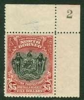 North Borneo 502. SG 293 North Borneo 1925-28. $5 lake corner marginal, hinged in top margin.