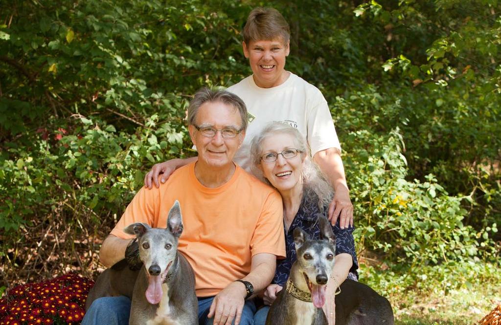 Eileen McCaughern is shown here with the Stewarts from Hamden, who adopted two greyhounds from her Woodbridge nonprofit organization.