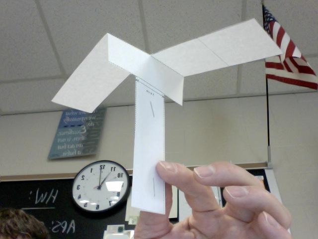 Paper Helicopter Experiment Name: 1. Make a paper helicopter according to the directions and the photo below. You will need scissors, two staples, and a template from which to cut out the helicopter.