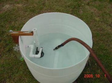 Fill the tank with water slowly with a hose or water buckets.