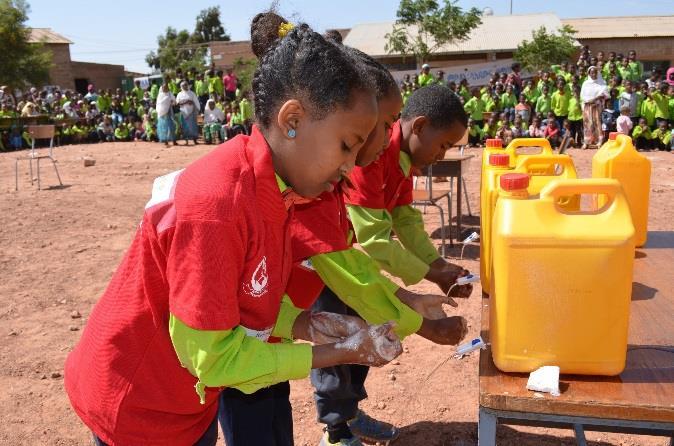 Photo: Handwashing demonstration by students, governmental officials and UNICEF.