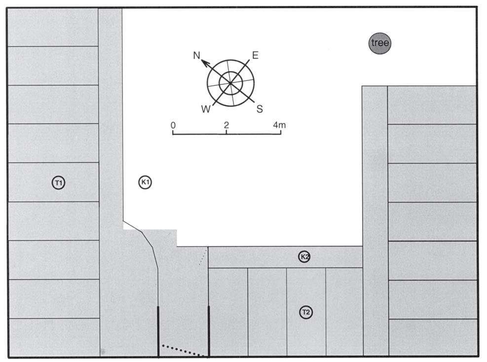 Figure 4. A schematic diagram of the physical features defining the two sites used in the aversiontraining phase. Areas of concrete flooring are shaded; the unshaded areas are grass.