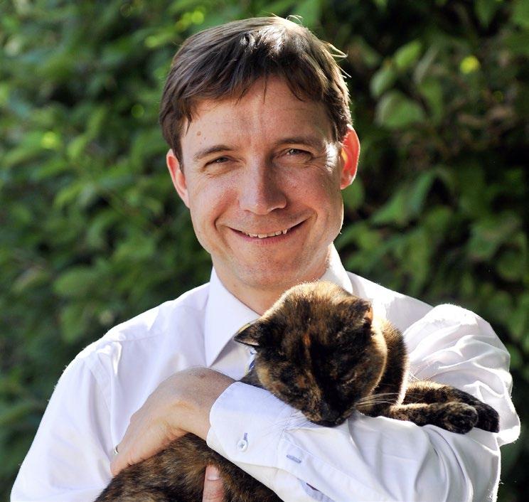 Although James Yeates, Chief Executive, Cats Protection with his cat Monkey responsible pet ownership.