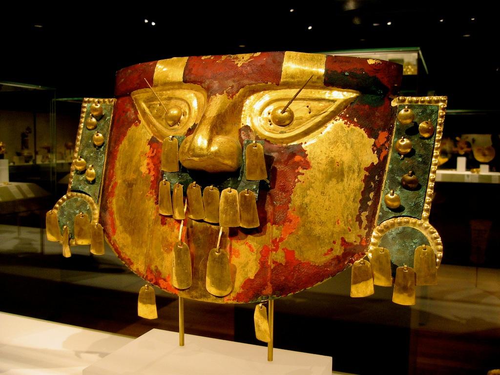 Credit: Xuan Che 10 or 11th century, a funerary mask from Lambayeque, Peru is made of gold with copper overlays, painted with cinnabar, a red ore of mercury. The mask is 11.5 (29.2 cm) high.