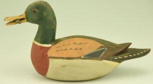 97 ¼ size carved Mallard drake with stick in bill unsigned