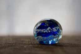 Glass Blown Memorials These glass urns are hand-blown, solid-glass sculptures within which the