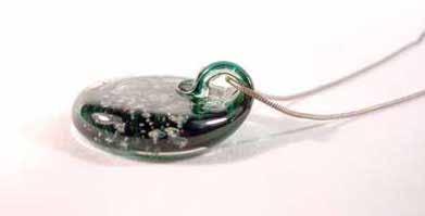 Blown Glass Pendants Suspended cremated remains within solid glass pendants - because memories are forever Memory Glass pendants are roughly the size of three