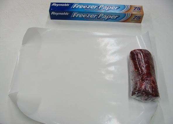 Now that you have two layers of plastic wrap over the meat.