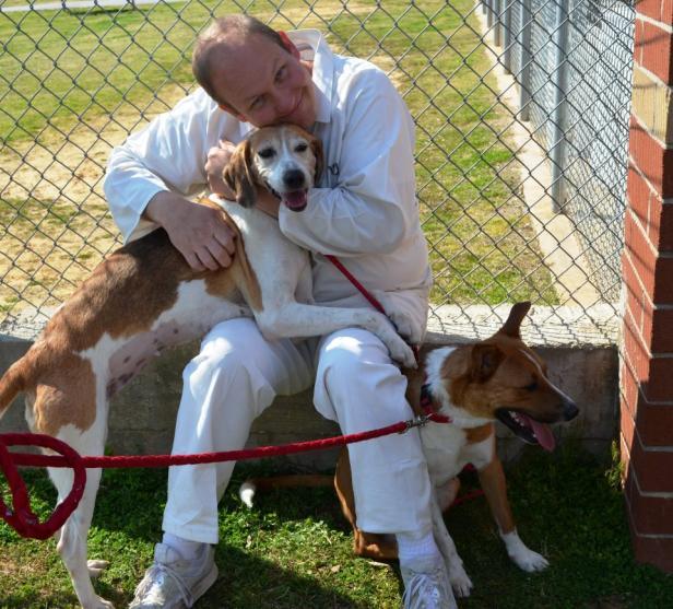 Inmates work with the dogs teaching them basic obedience skills and proper socialization, making them more