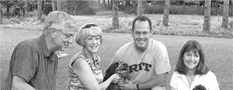August 2014 WPGCA E&R FOUNDATION Page 3 Rick and MaryAnn Sojda (left) paid a visit to Mark and Joanne Canfield and their dog Anya to welcome Brita Eso (with Joanne) to her new home in the US.