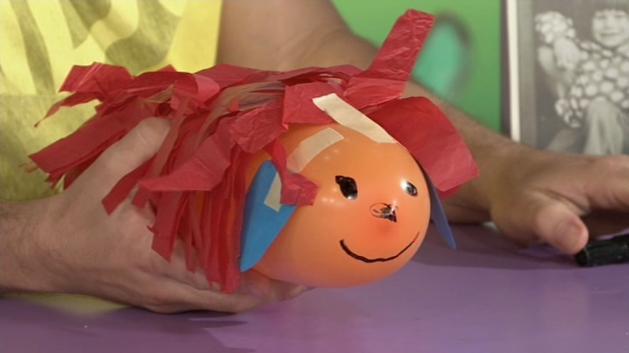 MAKE AND DO How to Make a Sausage Dog A long balloon Coloured paper Tape Tissue paper Marker Blow up the balloon and tie off. Cut two long ears from coloured paper and tape to the balloon.