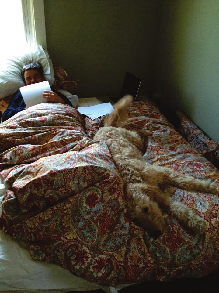 Chapter 4 In another post, a woman is reading in bed, flanked by a dog who is identified as her research