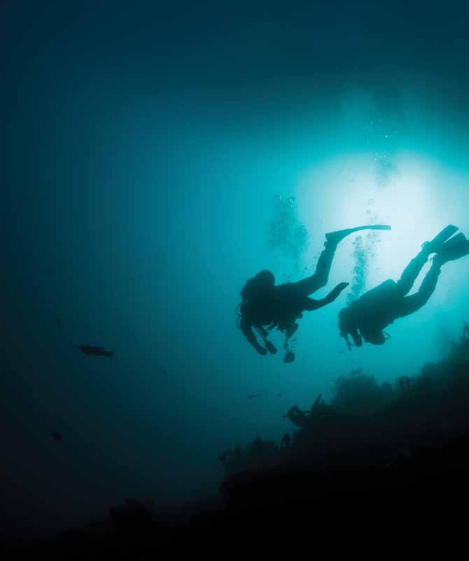 Scuba divers feel more water pressure the deeper they