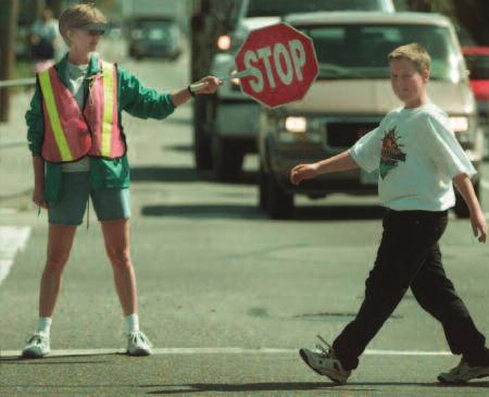 stop sign crossing guard student Slow