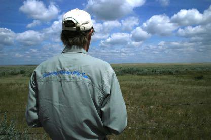 Paul Jones in the field looking at pronghorn habitat.
