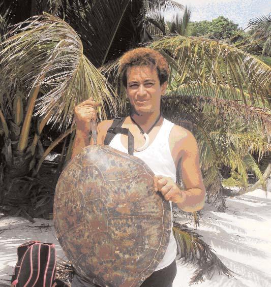 Photograph 5a-c. Youth holding a turtle shell, located at Oinafa Haua Island overlooking the Oinafa jetty.